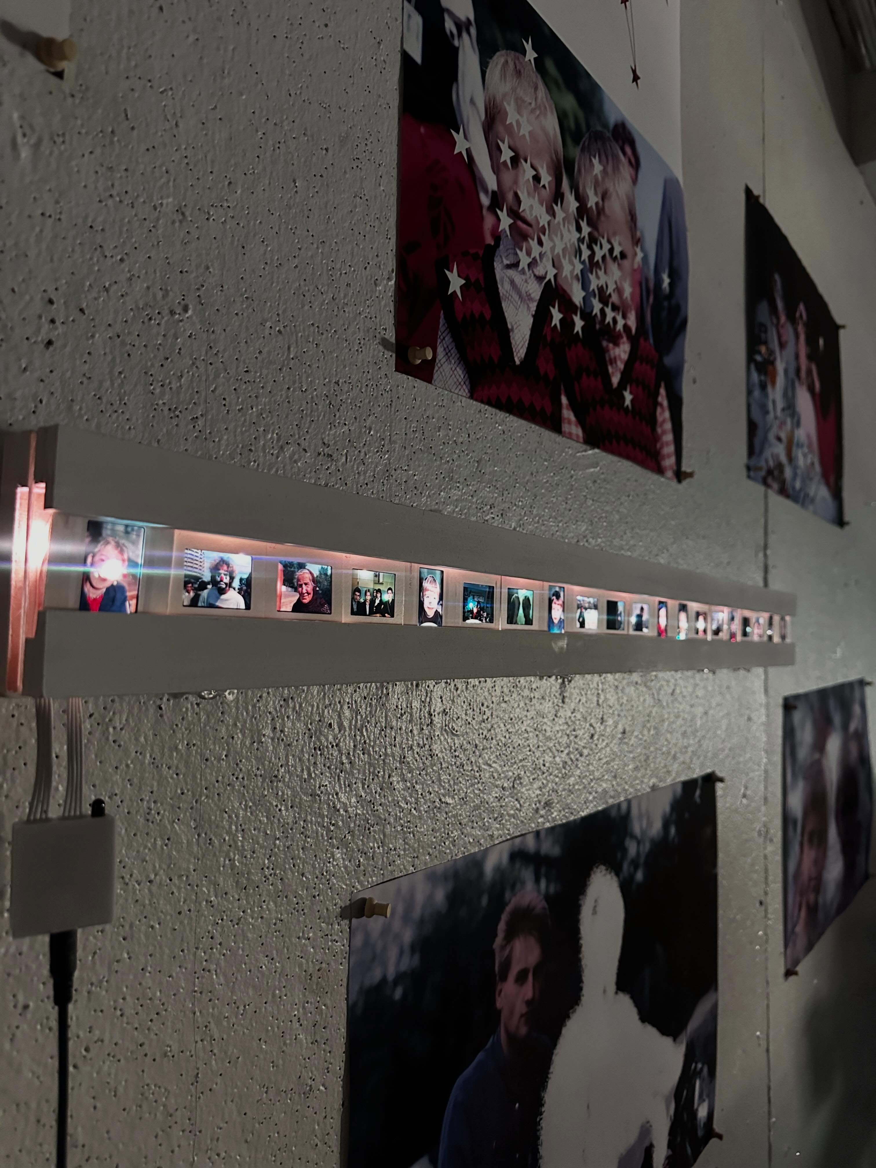 Installation view of the illuminated slide holder and archival images
